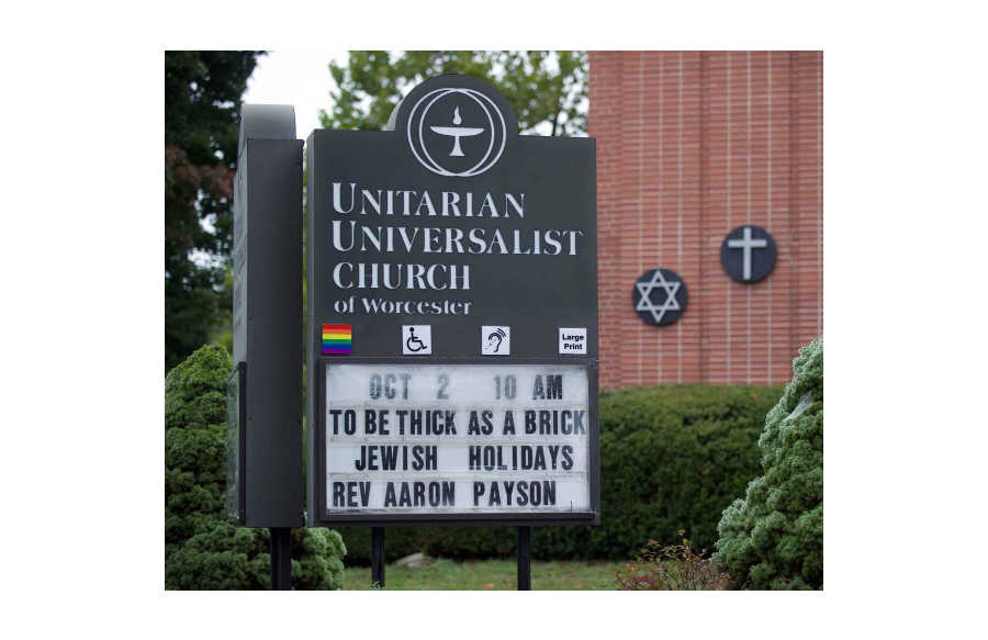 Accessibility and LGBTQI welcoming placards on church sign