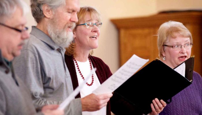 Close-up of choir members singing during a service