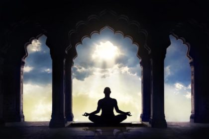 silhouette of person meditating