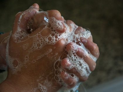 image of soapy hand washing