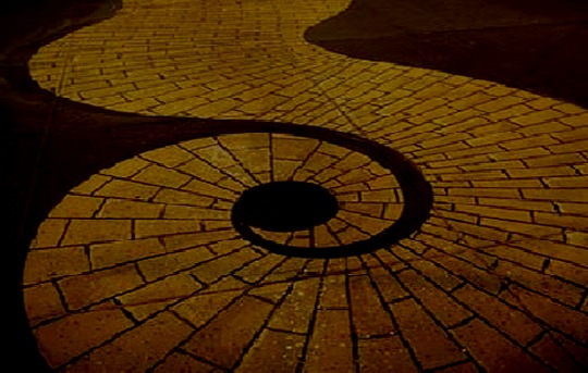 stylized image of curved road with yellow bricks