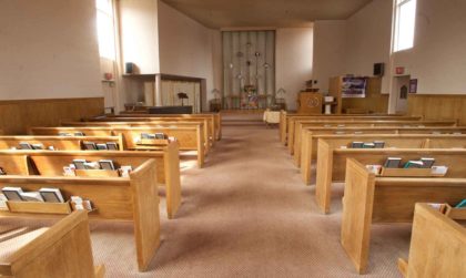 photo of uucw sanctuary from rear showing pews