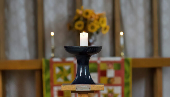 candle in chalice on UUCW altar area